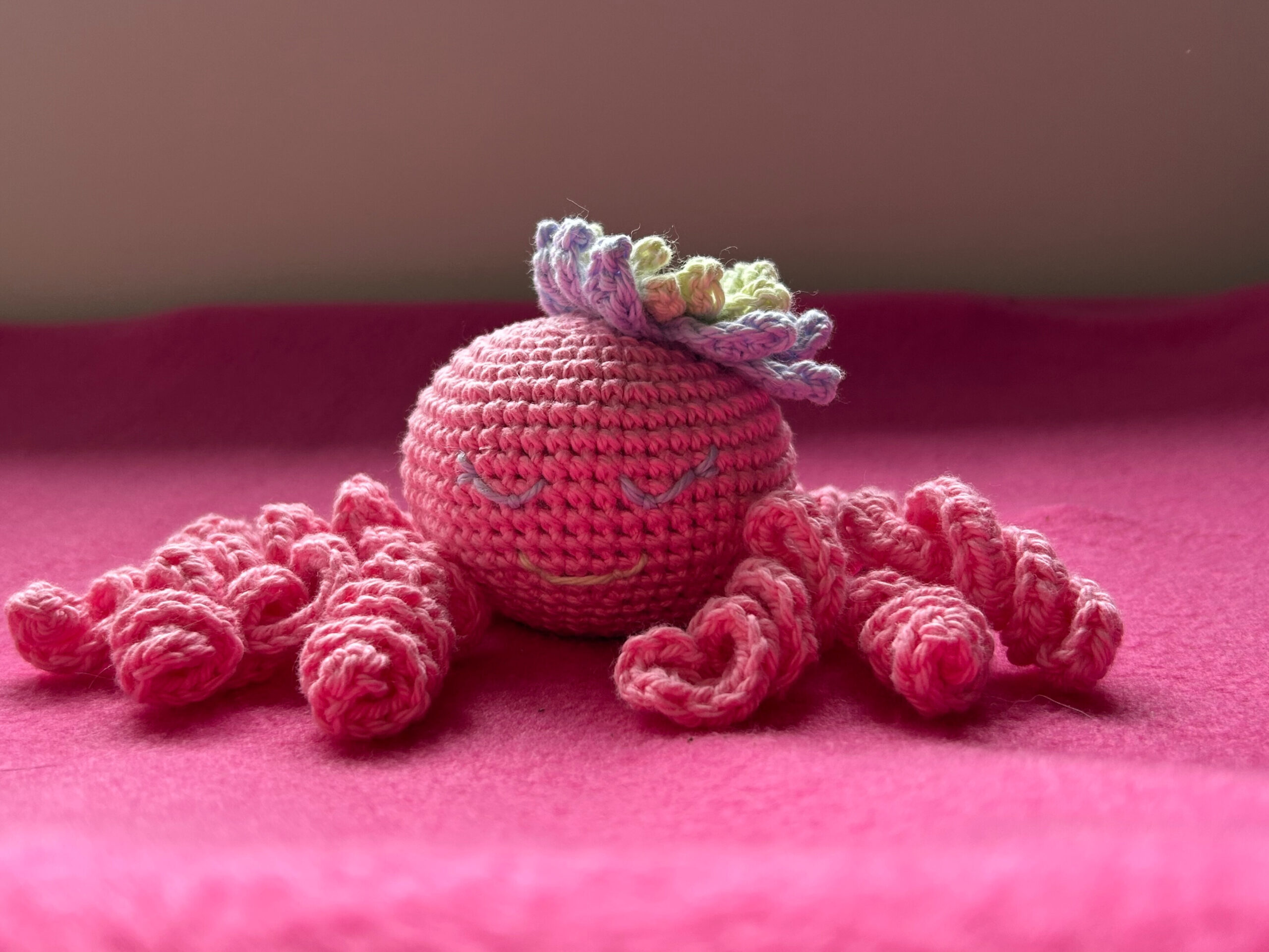 Finished crochet toy with embroidered face
